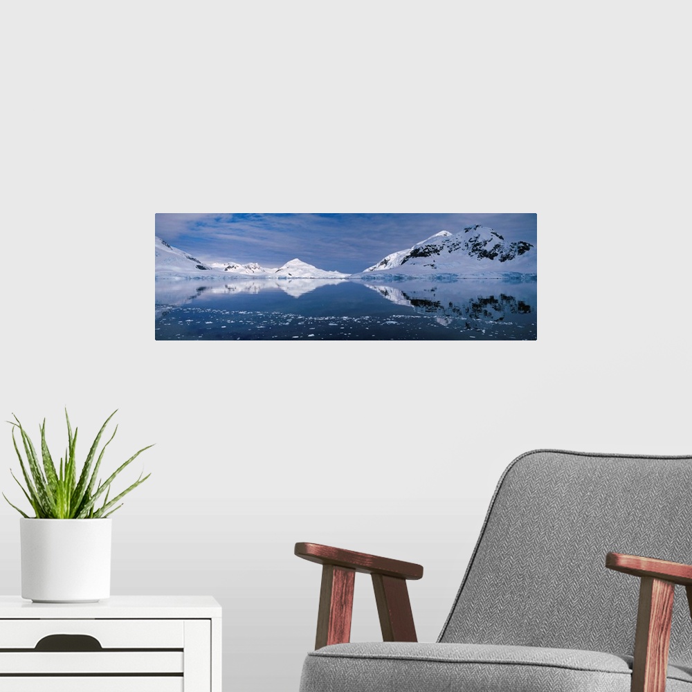 A modern room featuring Antarctica, Paradise Bay, Ice melting in the water