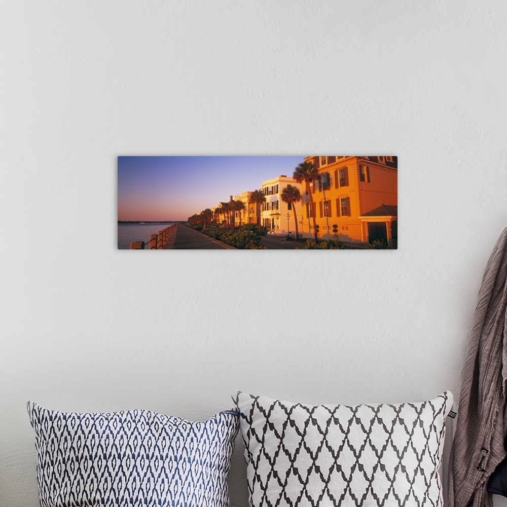 A bohemian room featuring Panoramic photograph shows a group of homes lining the streets of a beach town in the Southeaster...