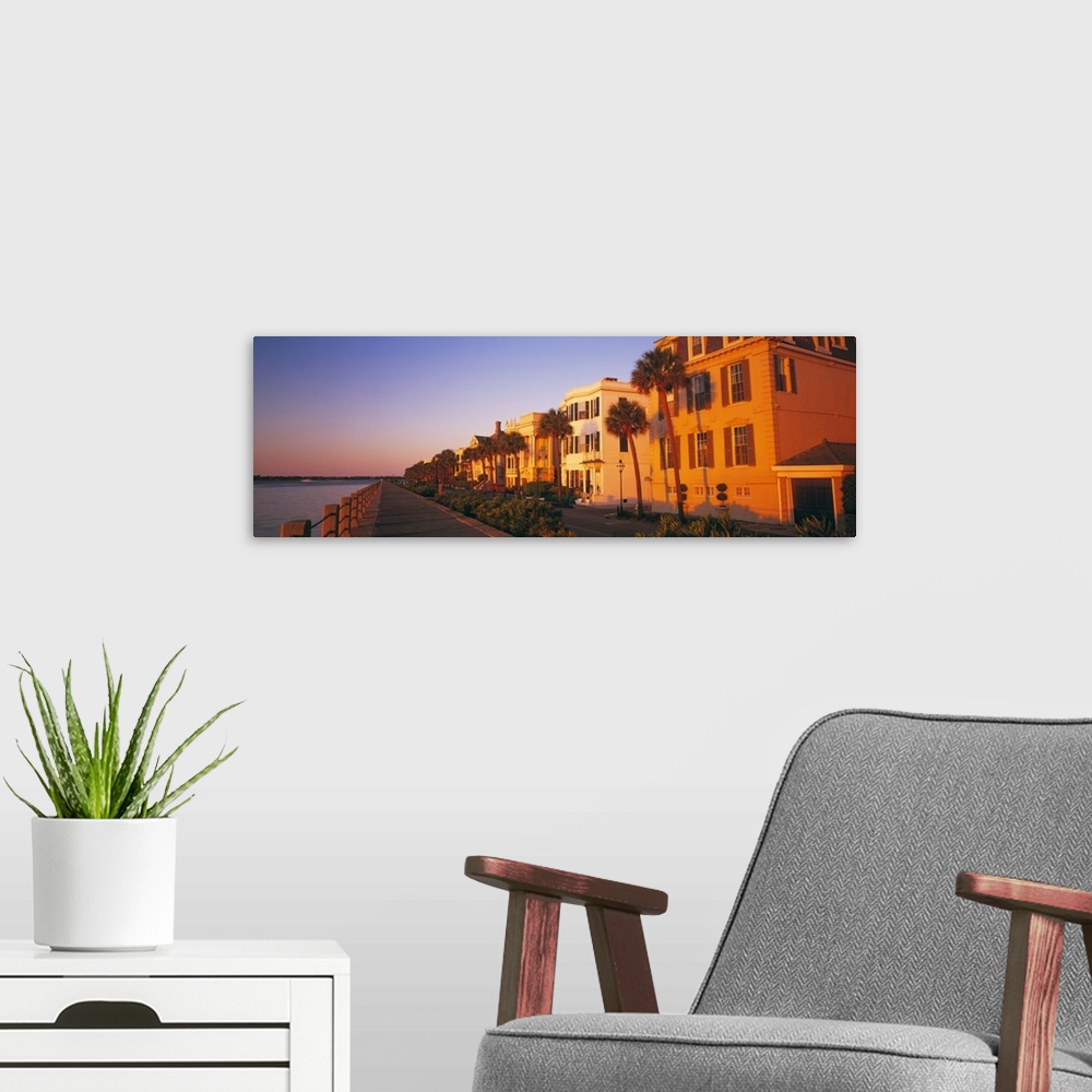 A modern room featuring Panoramic photograph shows a group of homes lining the streets of a beach town in the Southeaster...