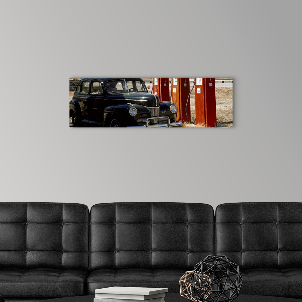 A modern room featuring Antique Car and Gas Pumps