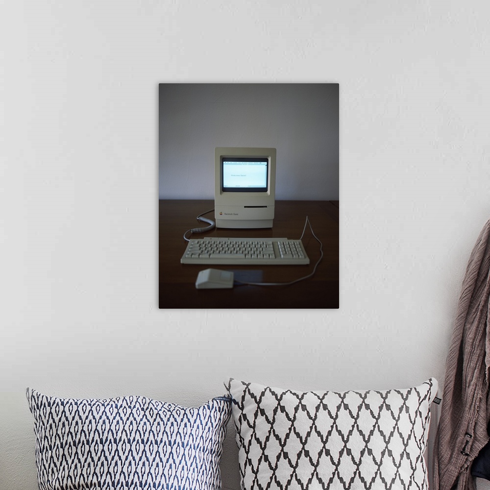 A bohemian room featuring Apple Macintosh Classic desktop PC