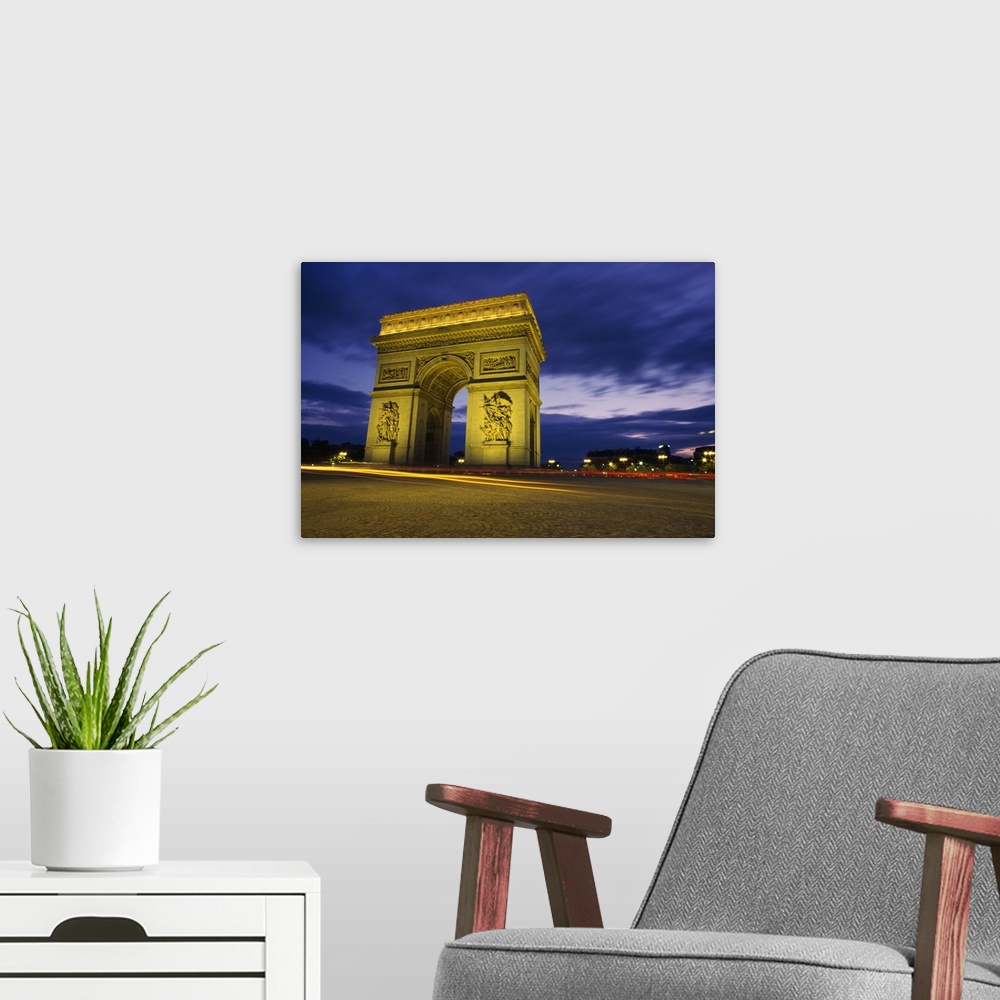 A modern room featuring Arc De Triomphe Illuminated At Night