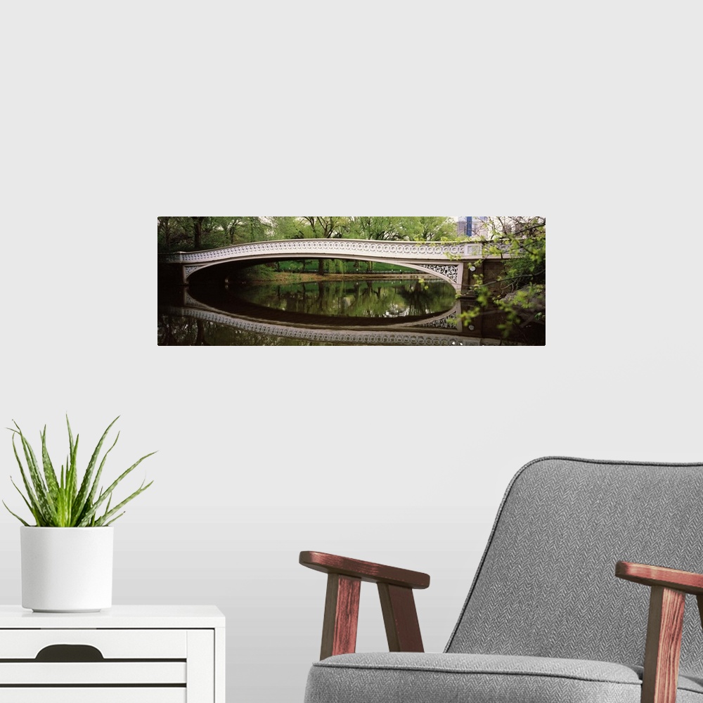 A modern room featuring Arch bridge across a lake Central Park Manhattan New York City New York State