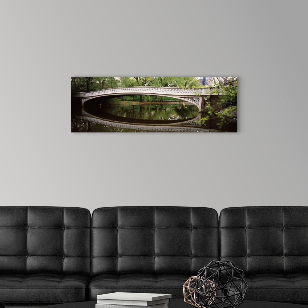 A modern room featuring Arch bridge across a lake Central Park Manhattan New York City New York State