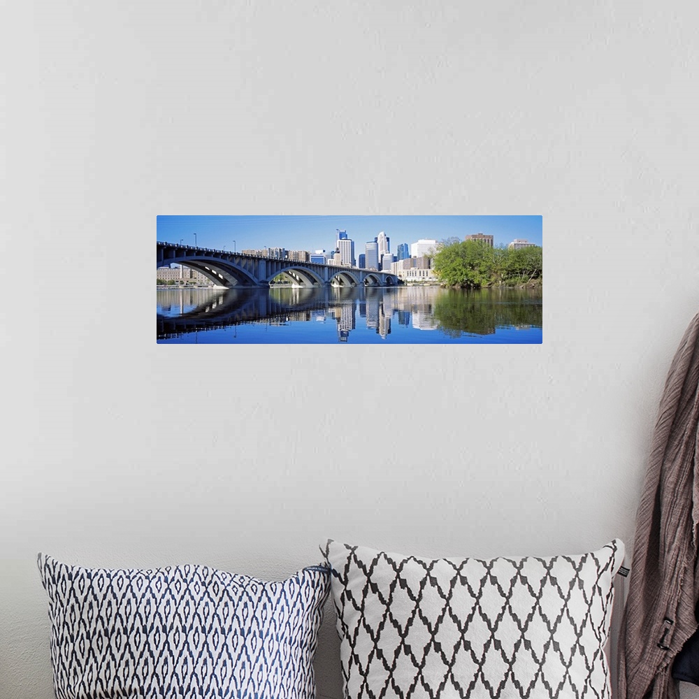 A bohemian room featuring Big panoramic photo of a bridge spanning across a river in Minneanapolis, Minnesota (MN) on a sun...