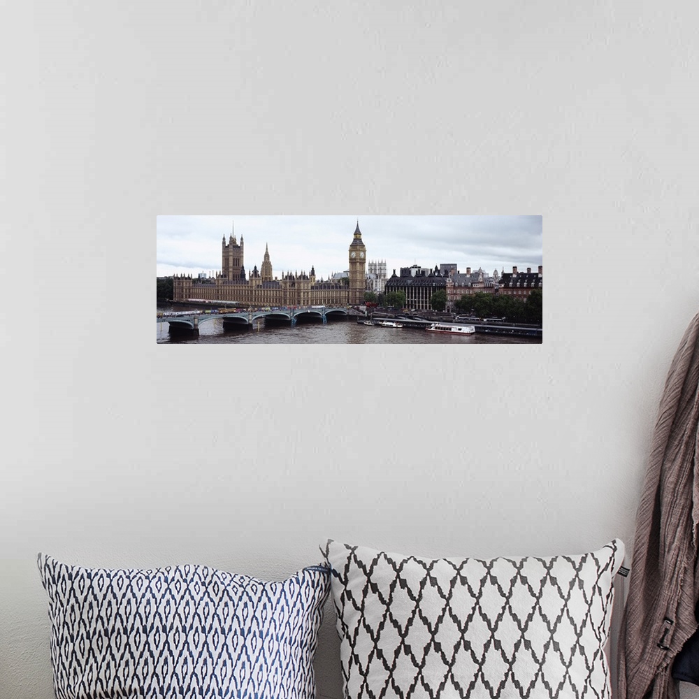 A bohemian room featuring Panoramic photo of a bridge leading into the city with boats in the river Thames, under a skyline...
