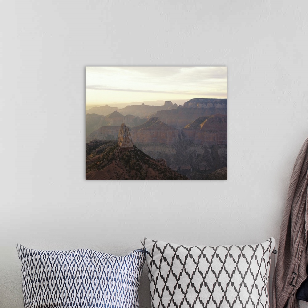 A bohemian room featuring Landscape photograph on a large canvas looking over the vast mountain range in Grand Canyon Natio...