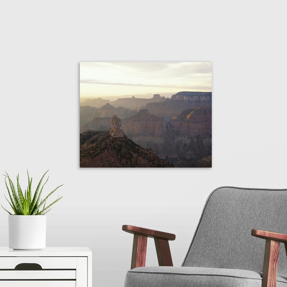 A modern room featuring Landscape photograph on a large canvas looking over the vast mountain range in Grand Canyon Natio...