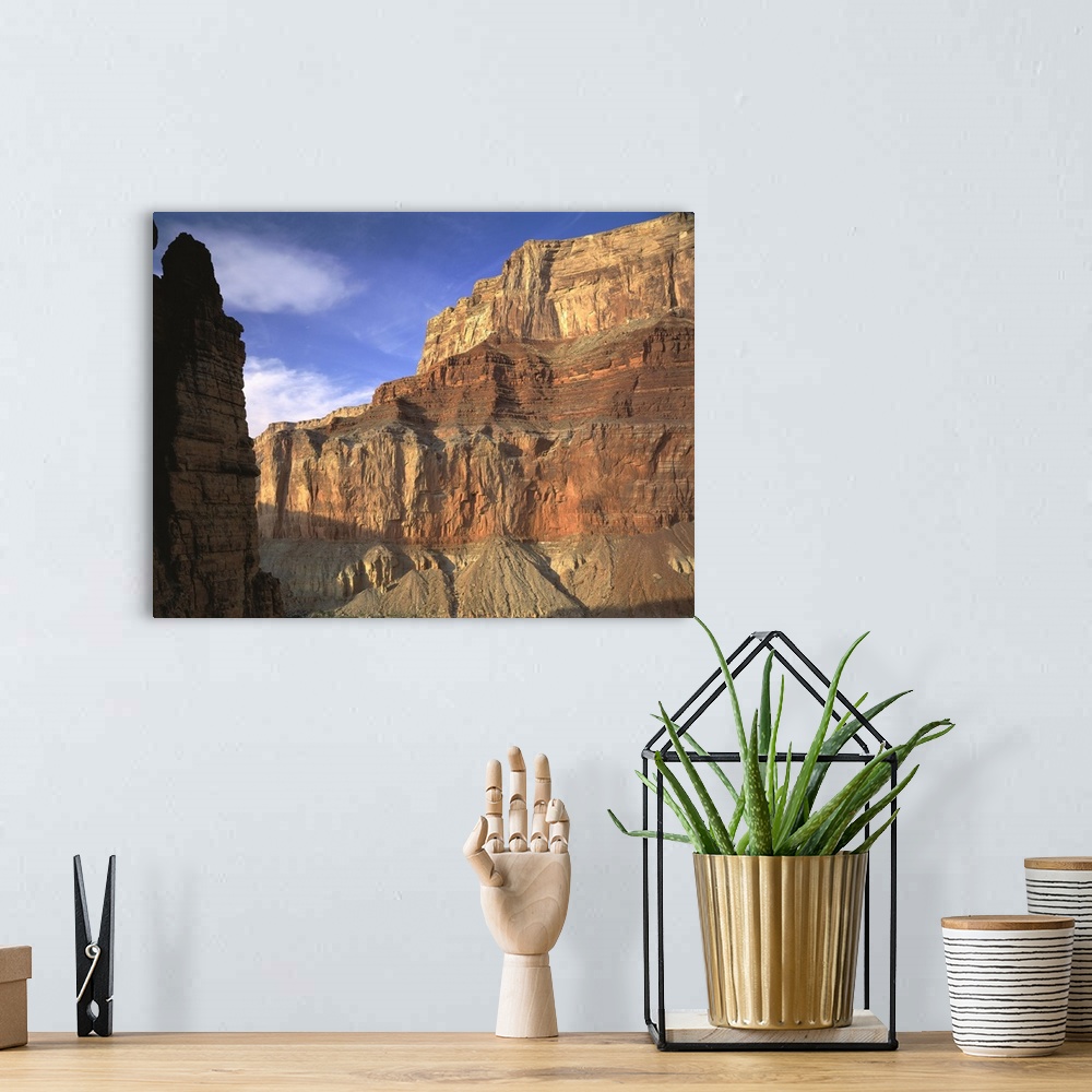 A bohemian room featuring Large, close up photograph of the side of  a mountain beneath a blue sky in the Grand Canyon Nati...