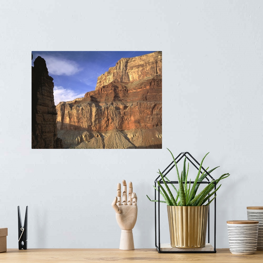 A bohemian room featuring Large, close up photograph of the side of  a mountain beneath a blue sky in the Grand Canyon Nati...