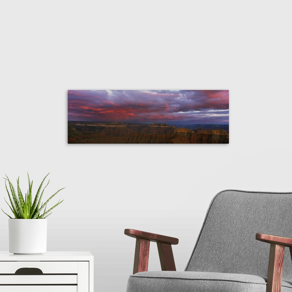 A modern room featuring Panoramic photo taken on the rim of the Grand Canyon looking out towards the other side as clouds...