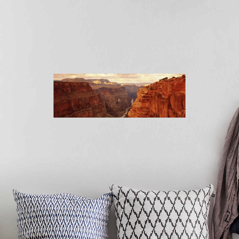 A bohemian room featuring Panoramic, landscape photograph of the Grand Canyon beneath a golden sky, in Arizona, at Toroweap...