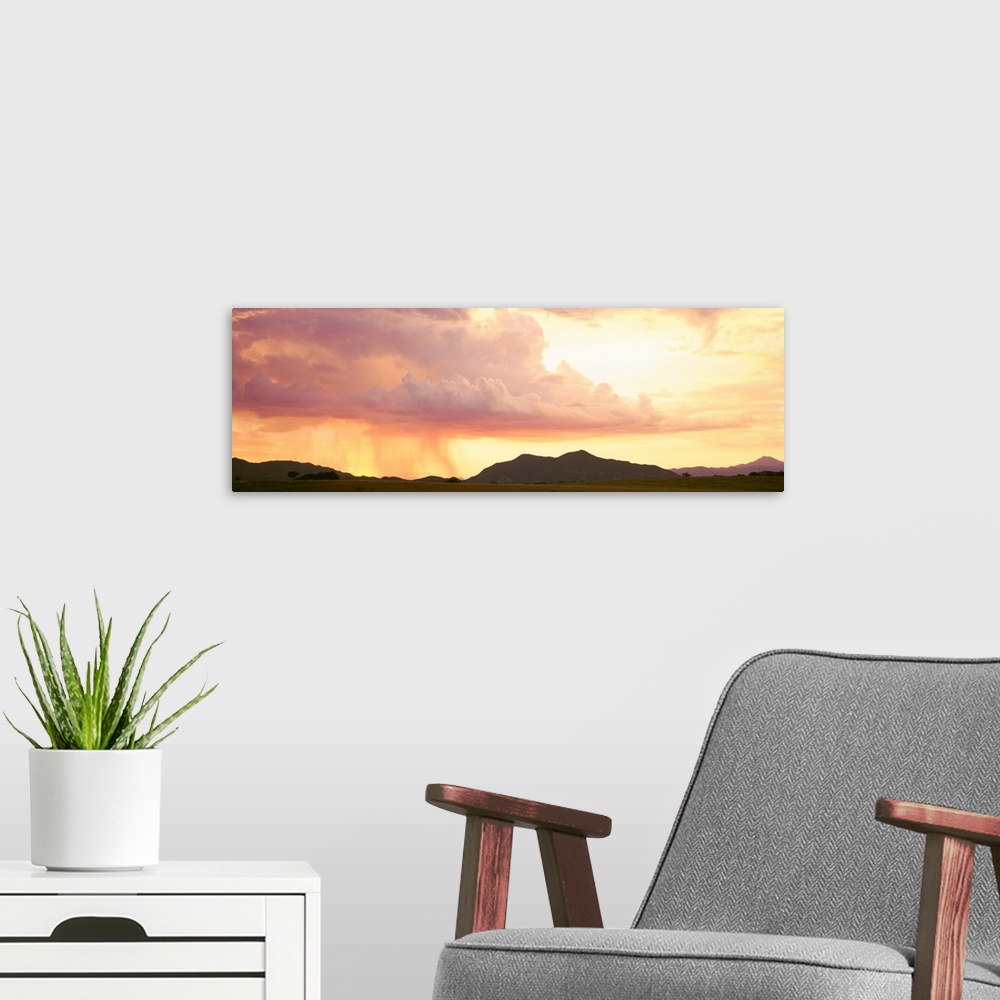 A modern room featuring Arizona, Huachuca Mountains, San Rafael Valley, rain storm at sunset