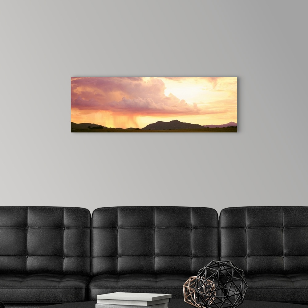 A modern room featuring Arizona, Huachuca Mountains, San Rafael Valley, rain storm at sunset