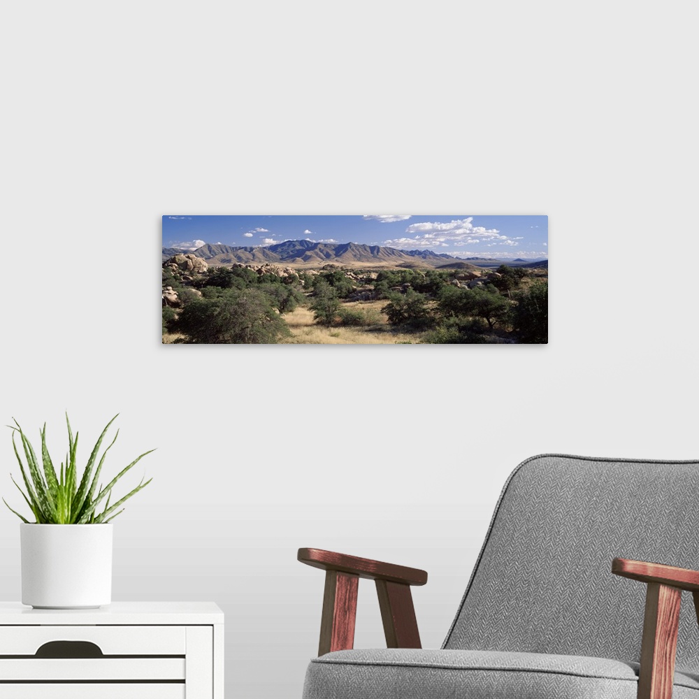 A modern room featuring Arizona, Texas Valley, Dragoon Mountains, Clouded sky over arid landscape