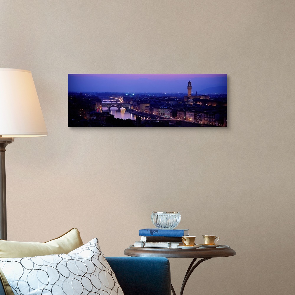 A traditional room featuring Panoramic photograph of skyline at night with buildings lit up.