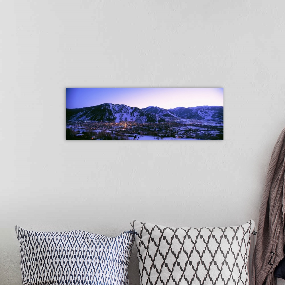 A bohemian room featuring Long panoramic photo of Aspen Colorado at dust nestled in the valley of the snow covered mountains.