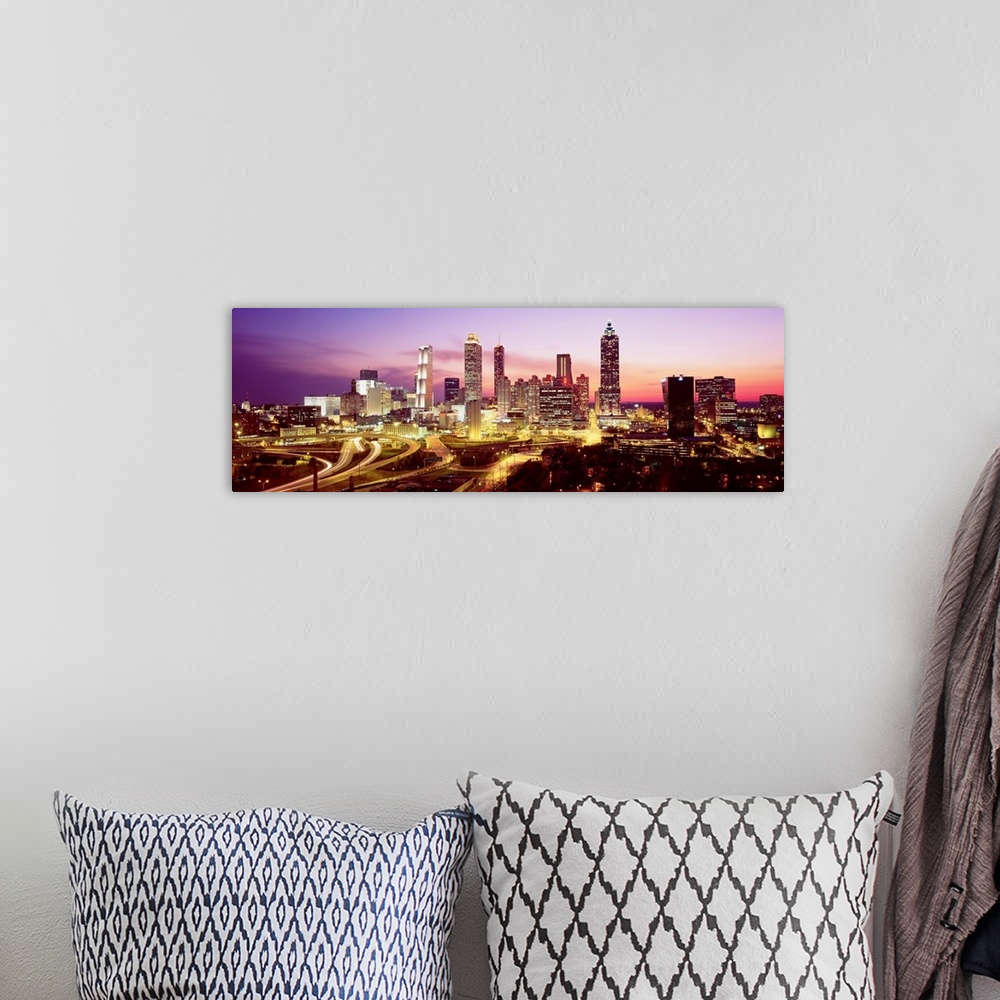 A bohemian room featuring Skyline of Atlanta, GA with buildings lit up.