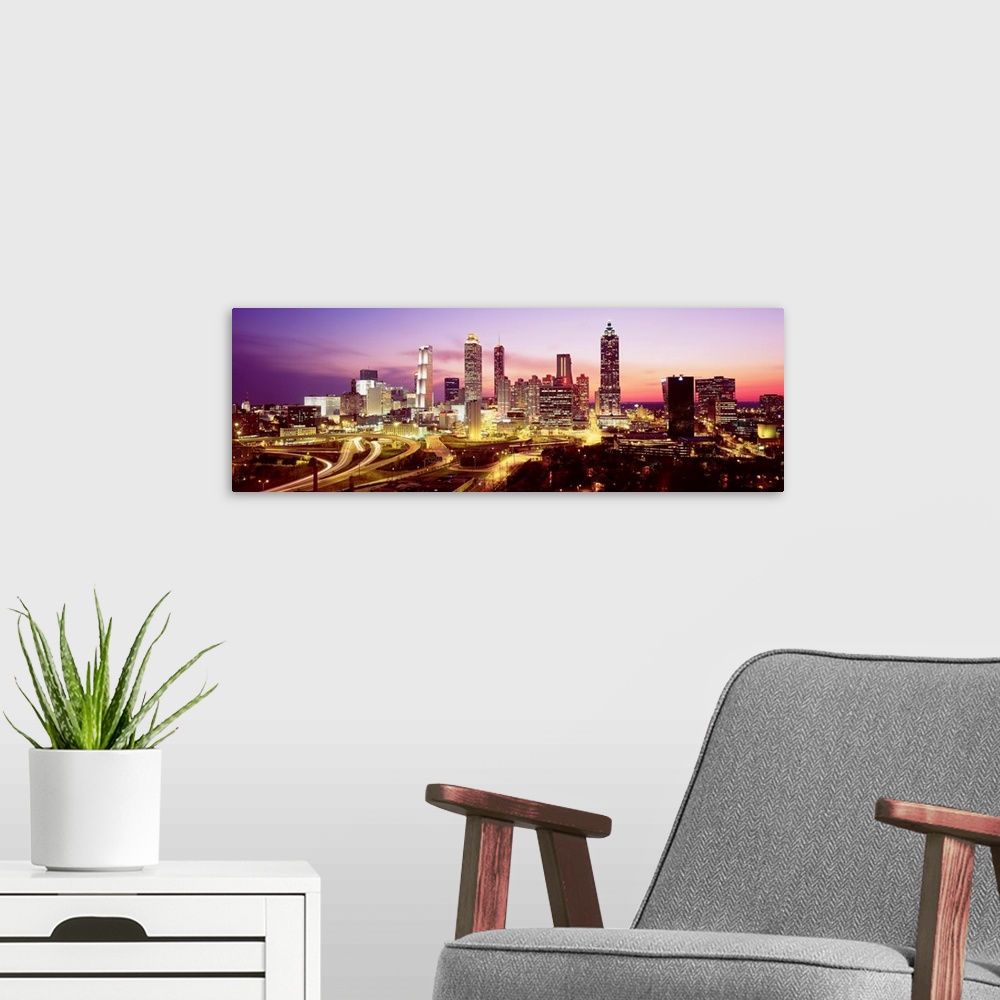 A modern room featuring Skyline of Atlanta, GA with buildings lit up.