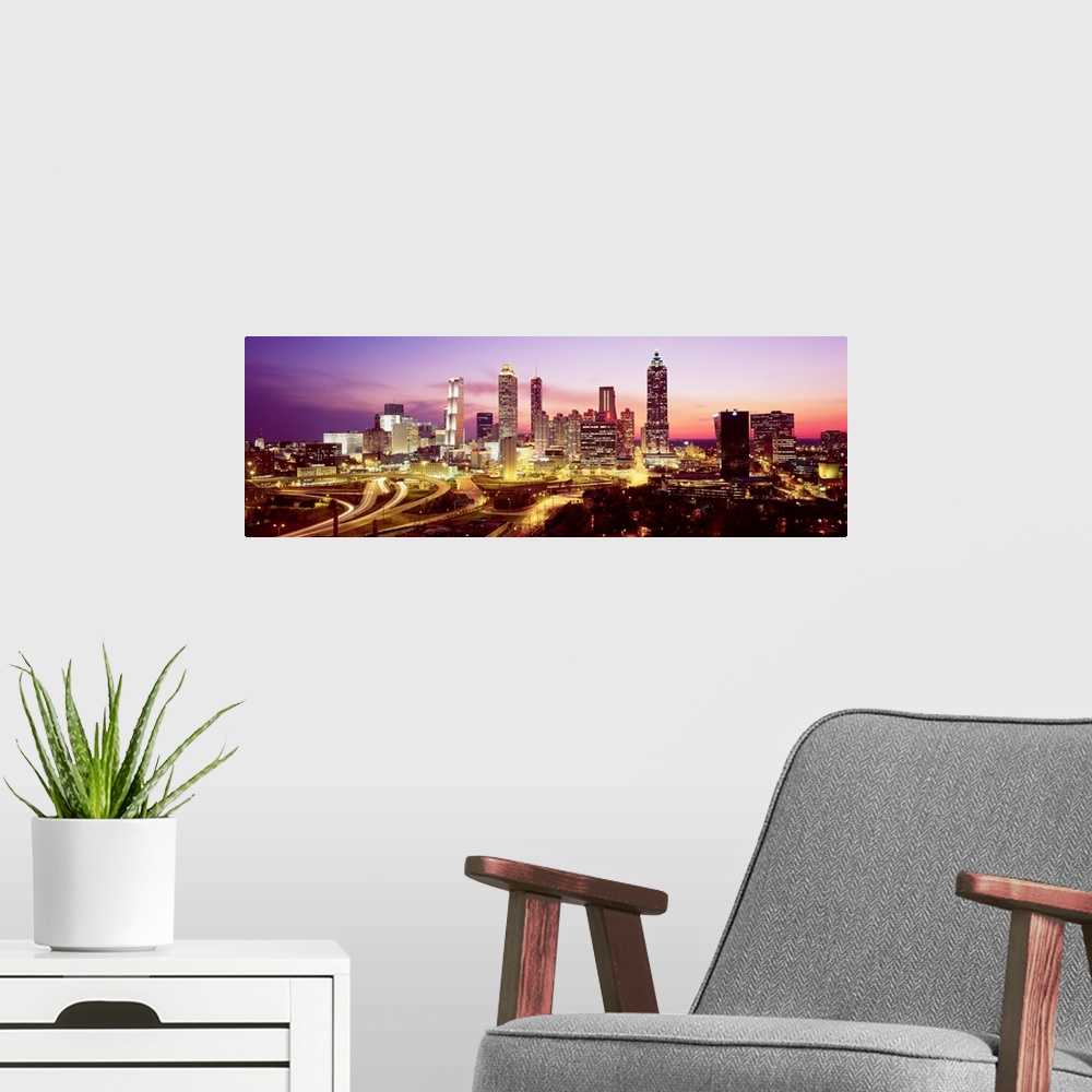 A modern room featuring Skyline of Atlanta, GA with buildings lit up.