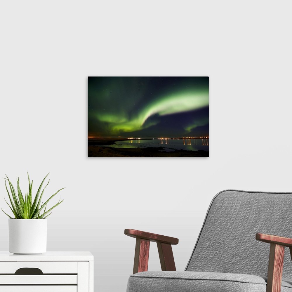 A modern room featuring Aurora Borealis in the sky, Alftanes, Reykjavik, Iceland