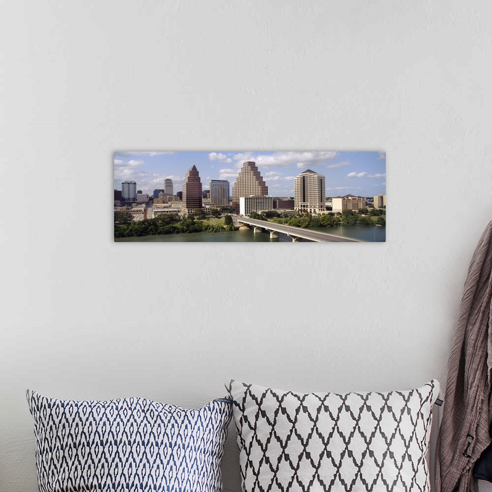 A bohemian room featuring Panoramic photograph of the Austin, Texas skyline beneath a blue sky with small fluffy clouds, th...