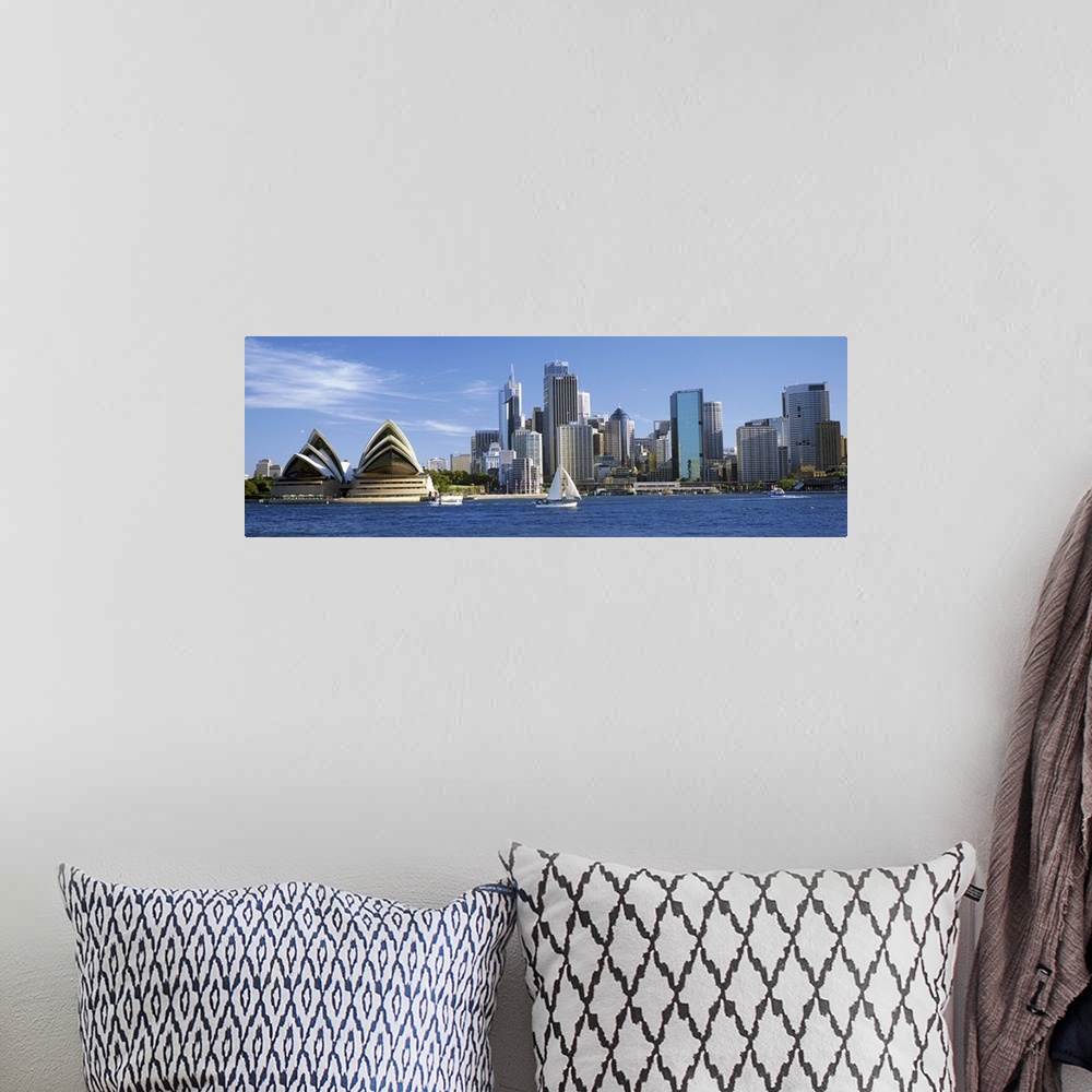 A bohemian room featuring Sydney skyline panorama, including the Opera House and harbor.