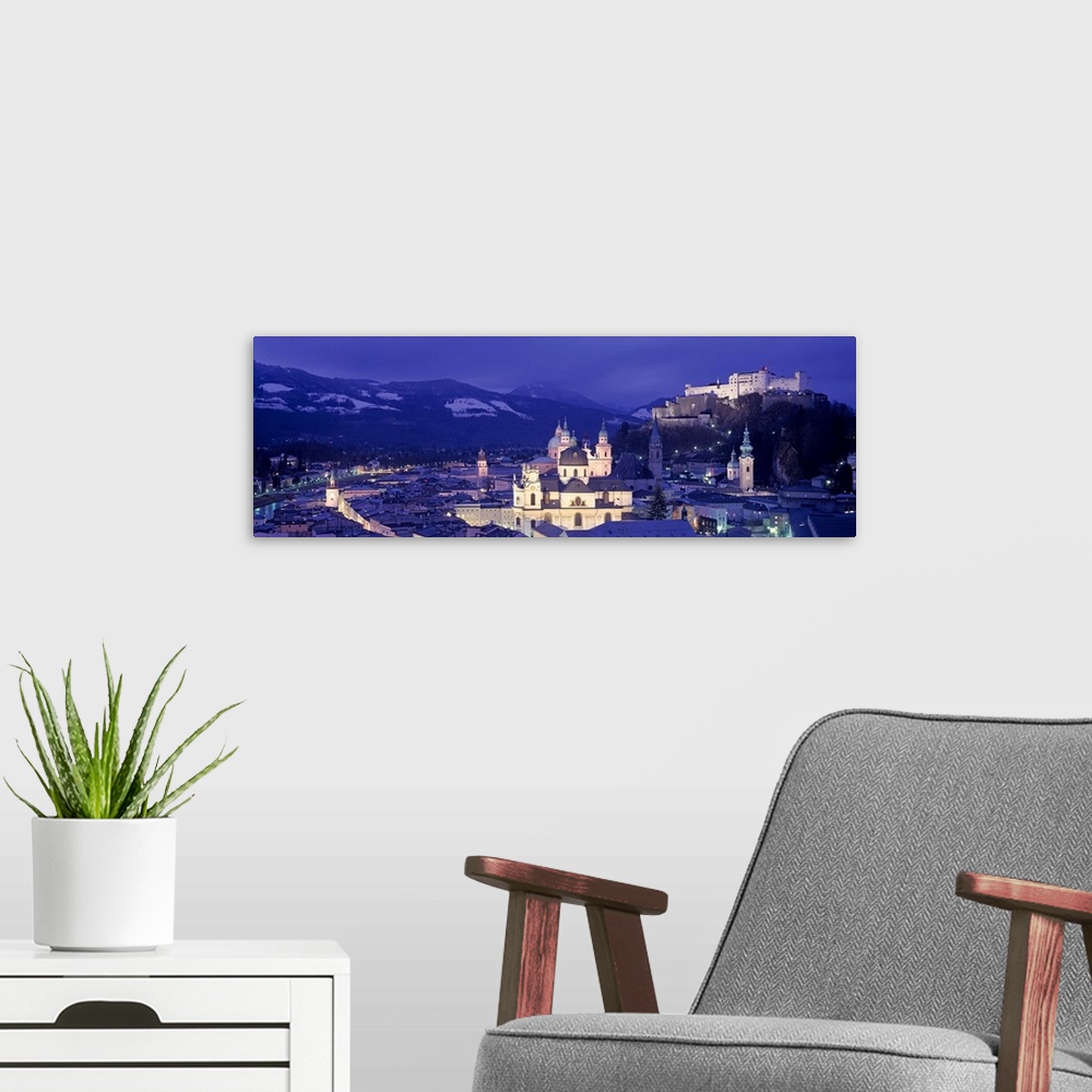 A modern room featuring Austria, Salzburg, Aerial view of a city at night