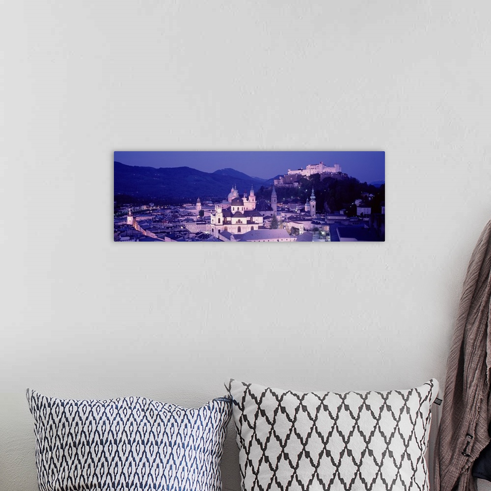 A bohemian room featuring Austria, Salzburg, Panoramic view of the city in dusk