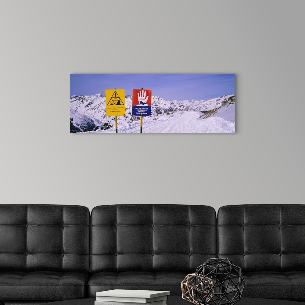 A modern room featuring Avalanche warning signs on snowcapped mountains, Rendl Ski Area, St. Anton, Austria