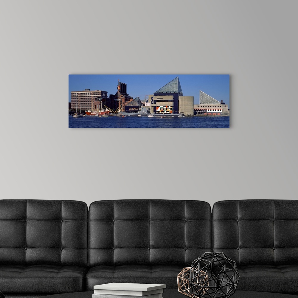 A modern room featuring Buildings in Baltimore are photographed in wide angle view from across the waterfront.
