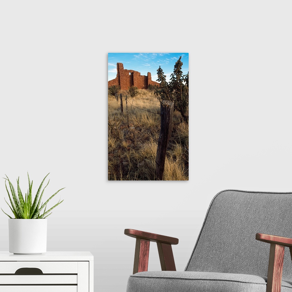 A modern room featuring Barbed-wire fence line, hilltop ruins, New Mexico