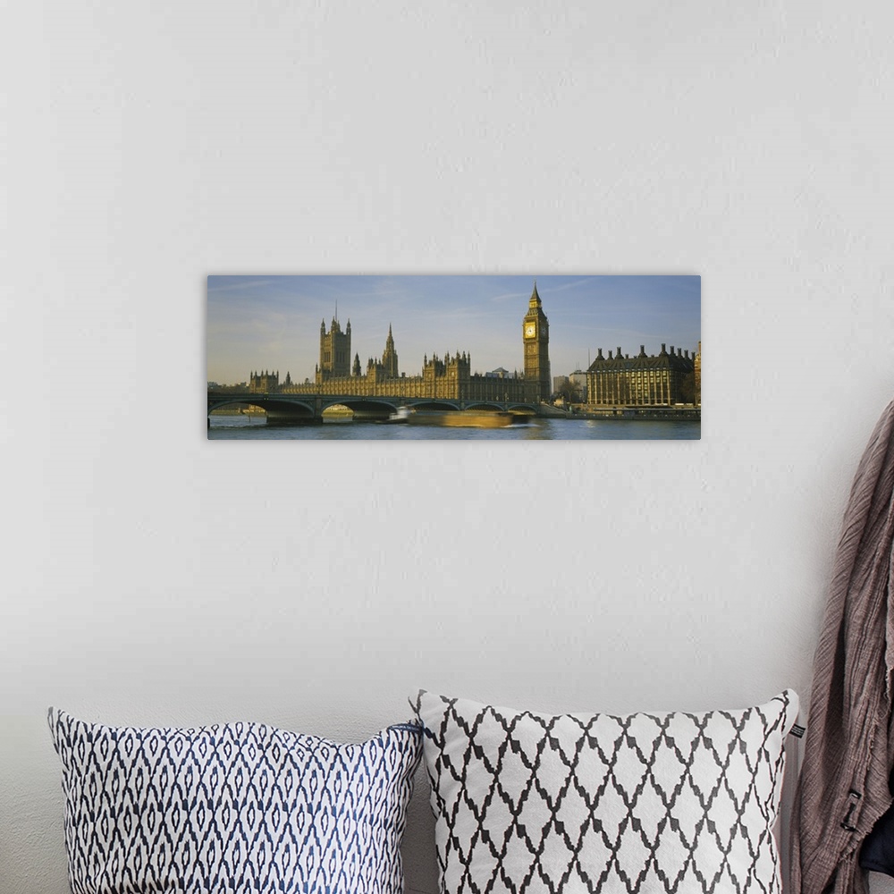 A bohemian room featuring Panoramic photograph of the London skyline, including Big Ben.  In the foreground, a barge in the...