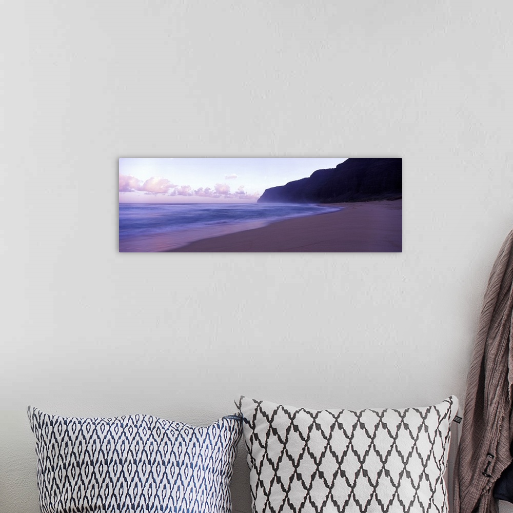 A bohemian room featuring Serene panoramic photograph of a Hawaii beach at dusk in soft cooler tones.