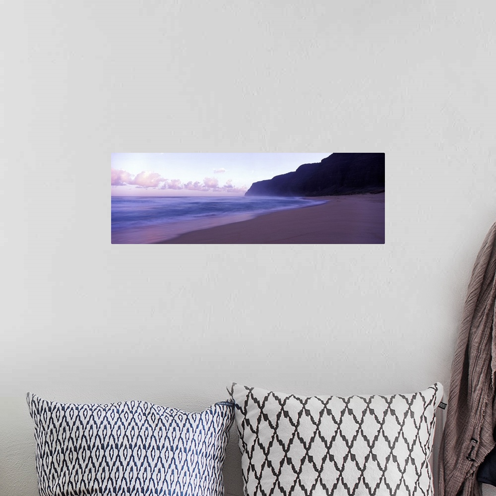 A bohemian room featuring Serene panoramic photograph of a Hawaii beach at dusk in soft cooler tones.