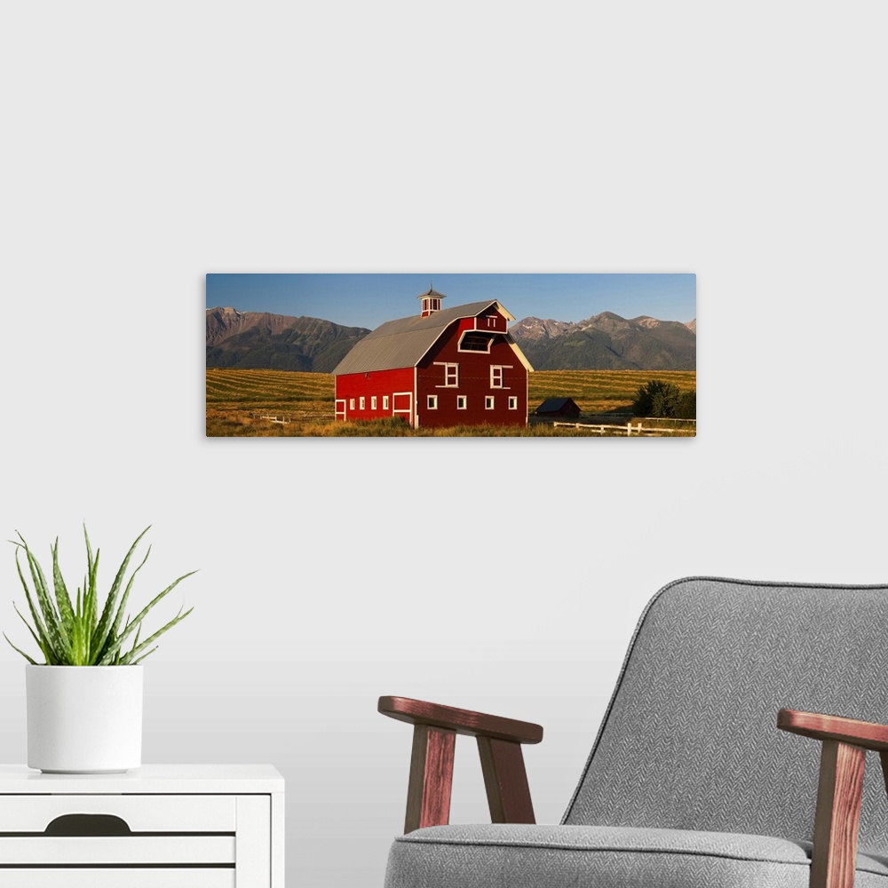 A modern room featuring Barn in a field with Wallowa Mountains in background, Enterprise, Oregon