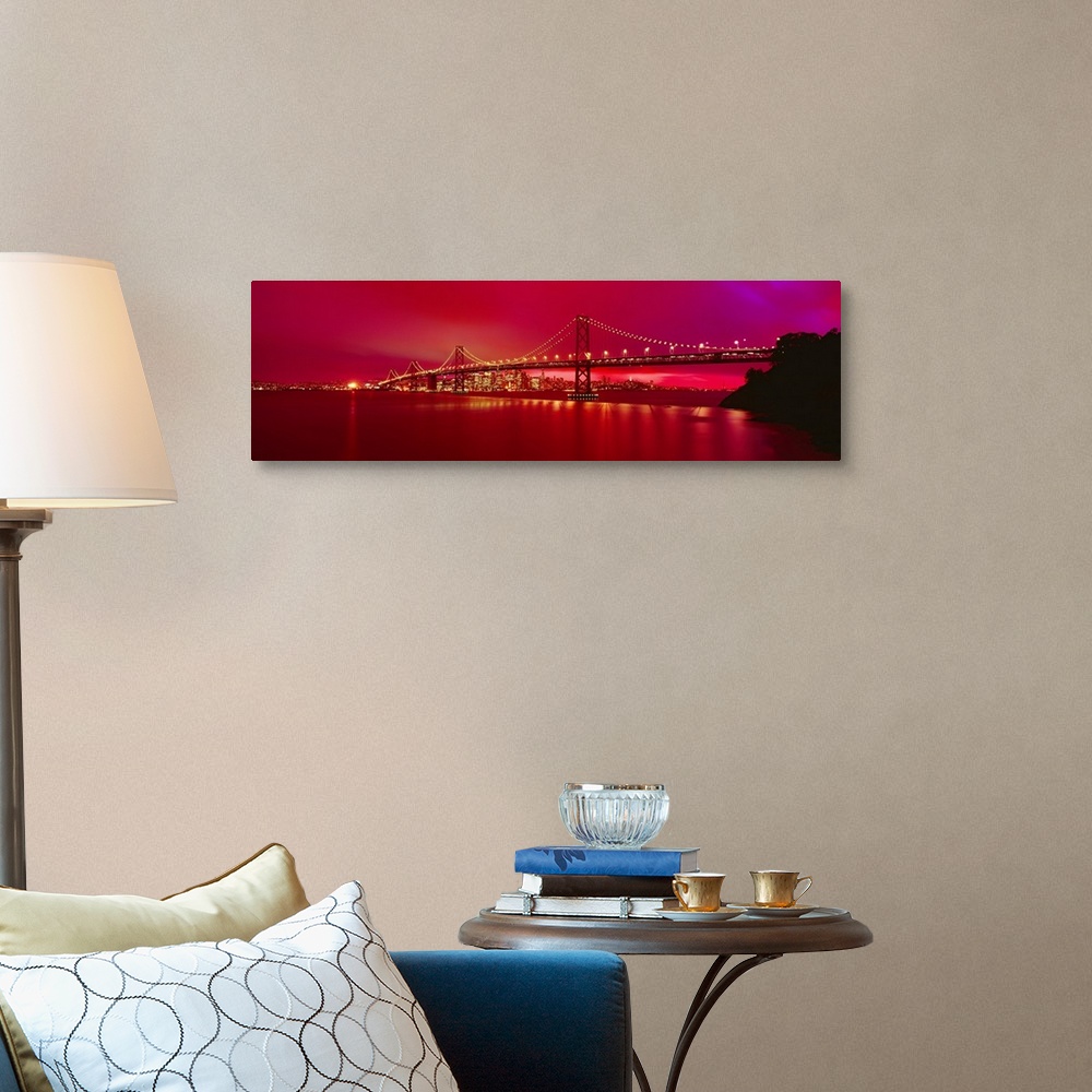A traditional room featuring This panoramic landscape photograph was taken at just time of day to turn the sky a brilliant hot...