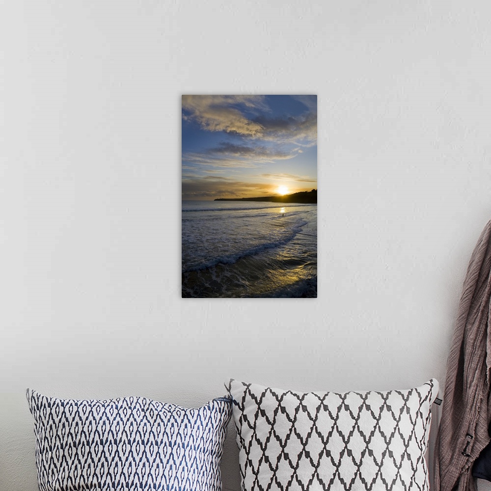 A bohemian room featuring This is a photograph of a sunset off the coast of Ireland with small waves crashing onto the beach.