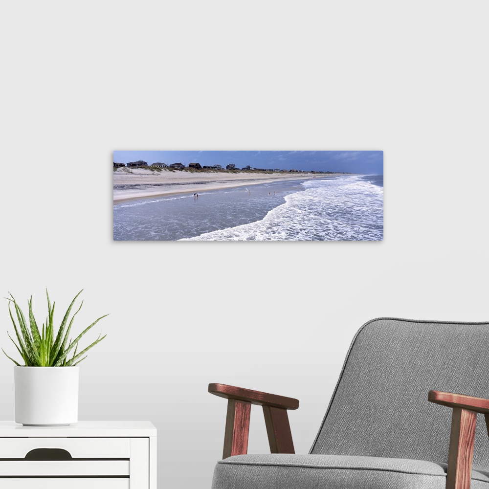 A modern room featuring Landscape, large photograph of the shoreline at an angle on Hatteras Beach in North Carolina.  A ...