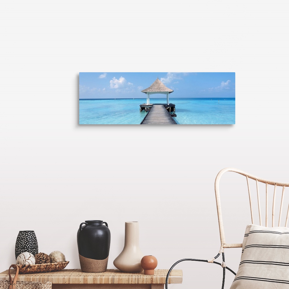 A farmhouse room featuring Oversized panoramic photograph of a pier extending into the crystal clear waters of the Maldives,...