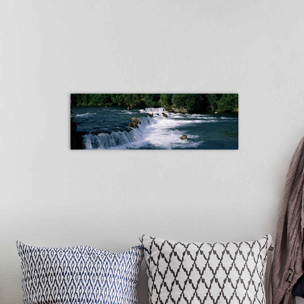 A bohemian room featuring This large panoramic piece shows bears fishing in water and some about to jump down a small water...