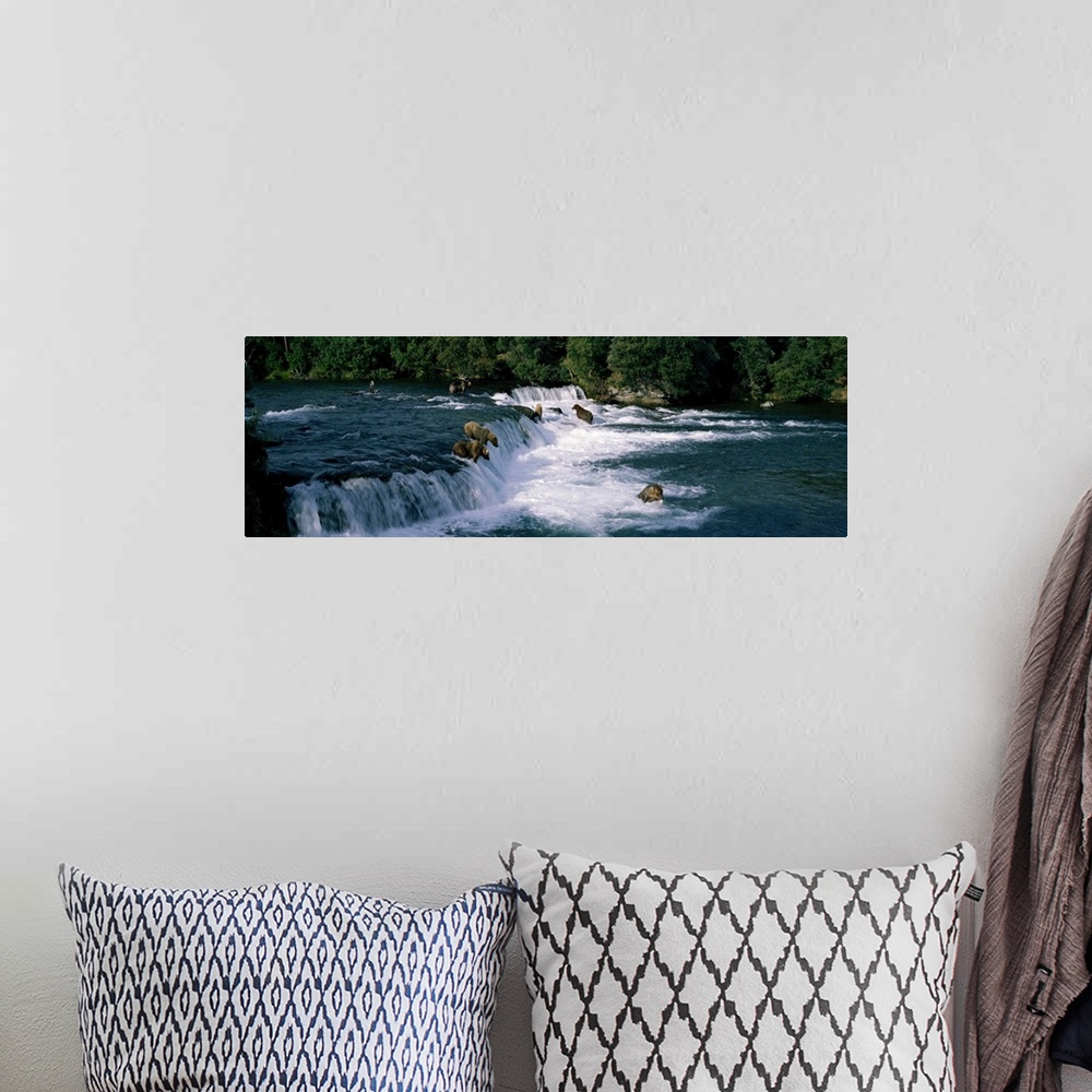 A bohemian room featuring This large panoramic piece shows bears fishing in water and some about to jump down a small water...