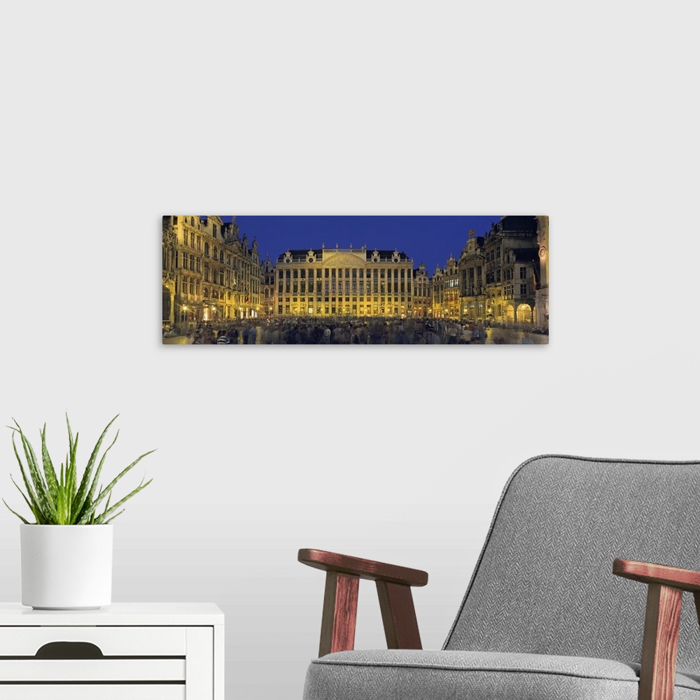 A modern room featuring Belgium, Brussels, Grand Palace Square, View of a crowd outside a vintage building