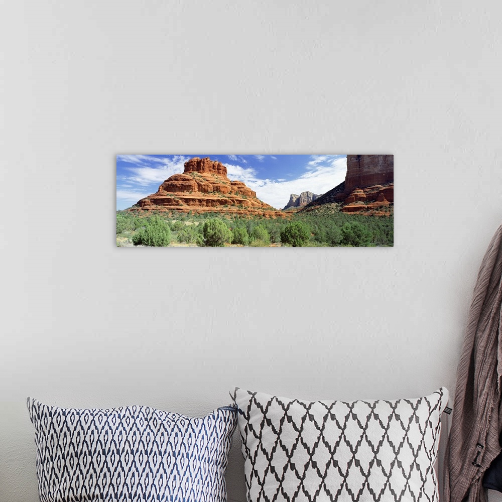 A bohemian room featuring Panoramic photo on canvas of big rock formations in the desert.