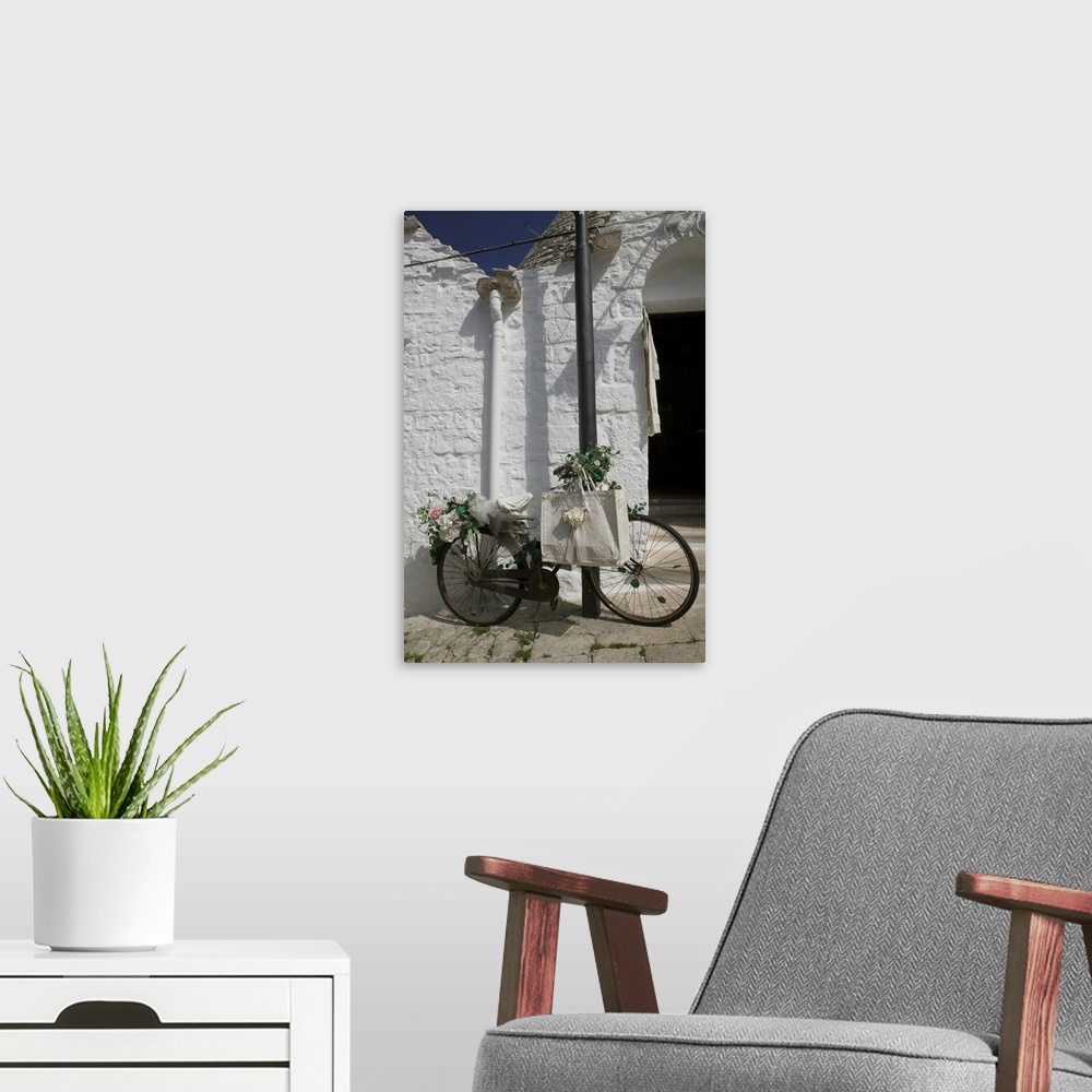 A modern room featuring Bicycle parked against a pole, Trulli House, Alberobello, Apulia, Italy