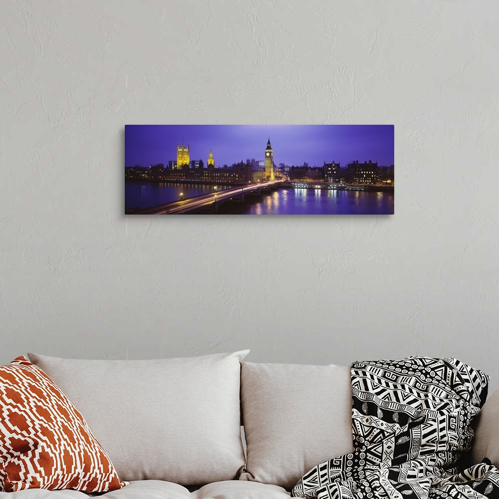A bohemian room featuring Cityscape of London at twilight, showing light trails from traffic along the bridge and lights fr...