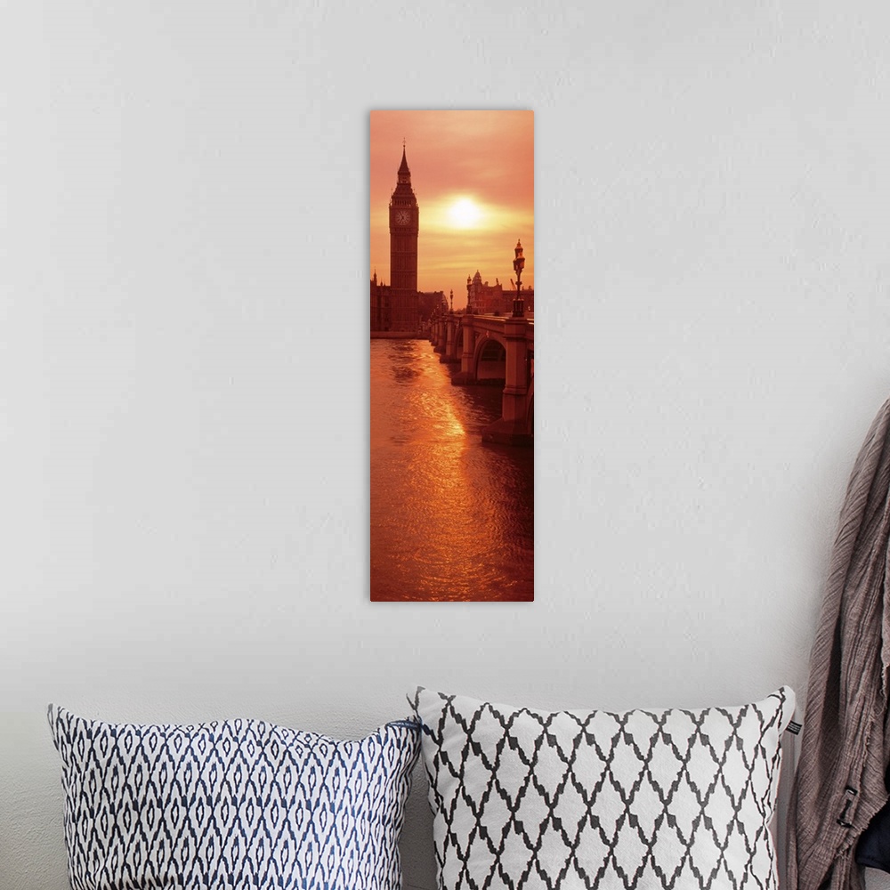 A bohemian room featuring A vertical panoramic photograph taken of Big Ben from across the bridge and over a body of water....