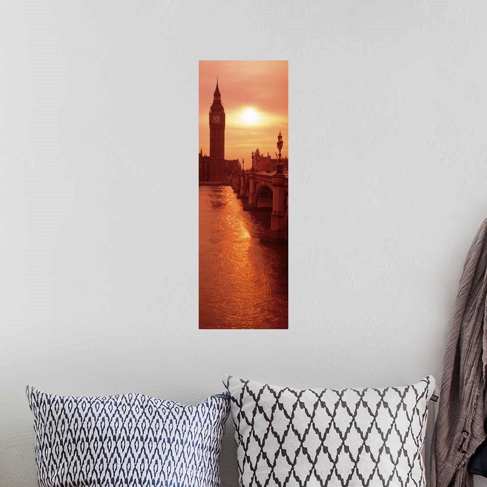 A bohemian room featuring A vertical panoramic photograph taken of Big Ben from across the bridge and over a body of water....