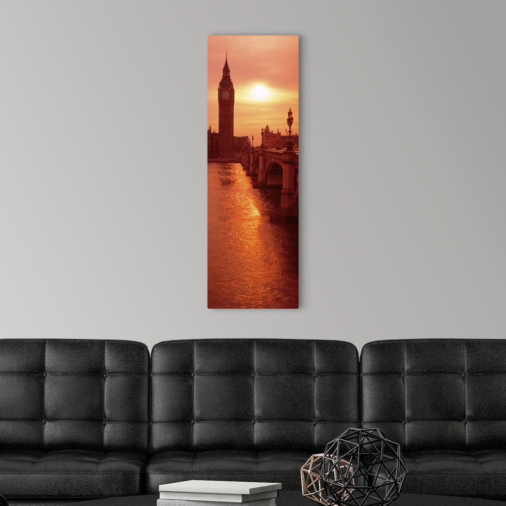 A modern room featuring A vertical panoramic photograph taken of Big Ben from across the bridge and over a body of water....