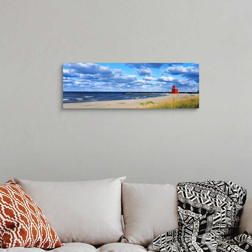 A bohemian room featuring Panoramic photograph of a large lighthouse next to a dock on a sandy beach in Holland, Michigan d...